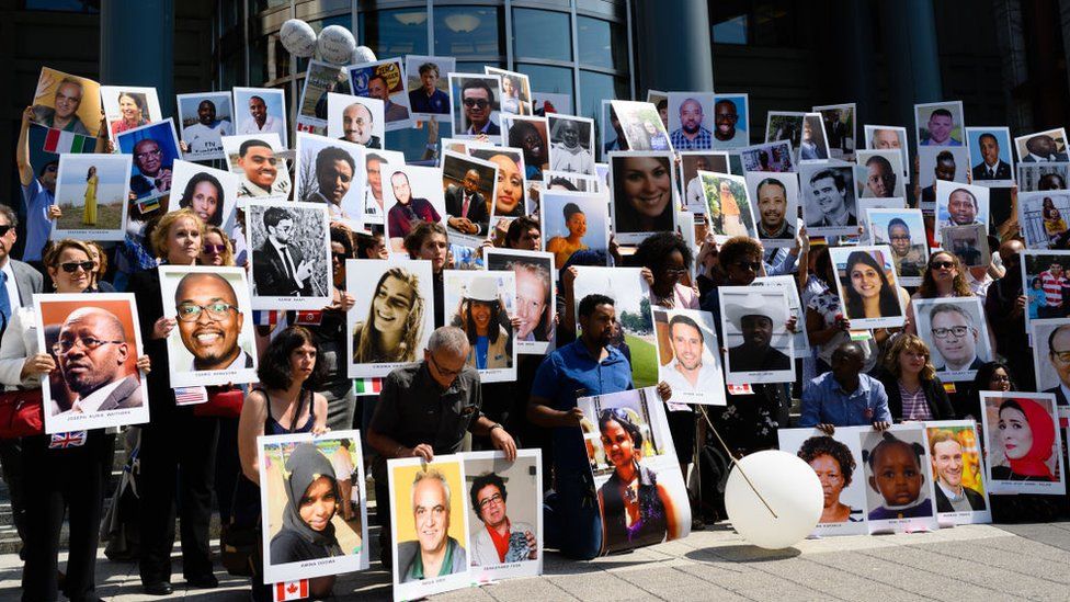 The families of the victims of the Ethiopian Airlines crash holding a vigil in front of the US Department of Transportation headquarters in Washington, DC in September 2019. 
