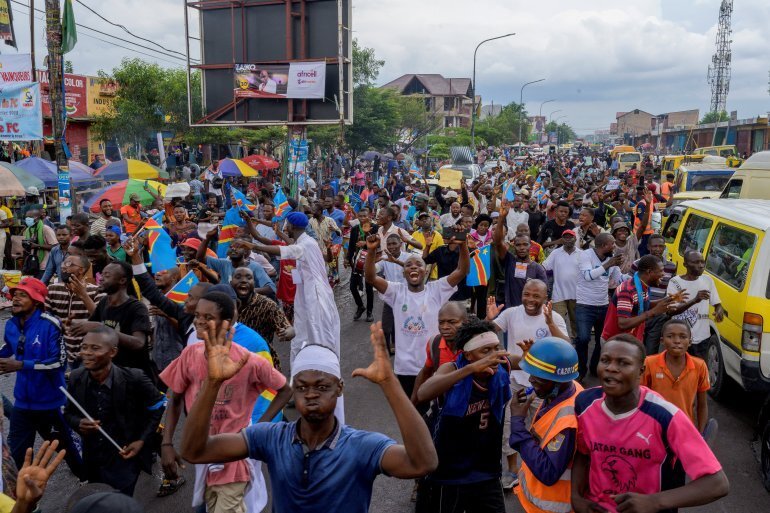 People take part in the protest in Kinshasa. 