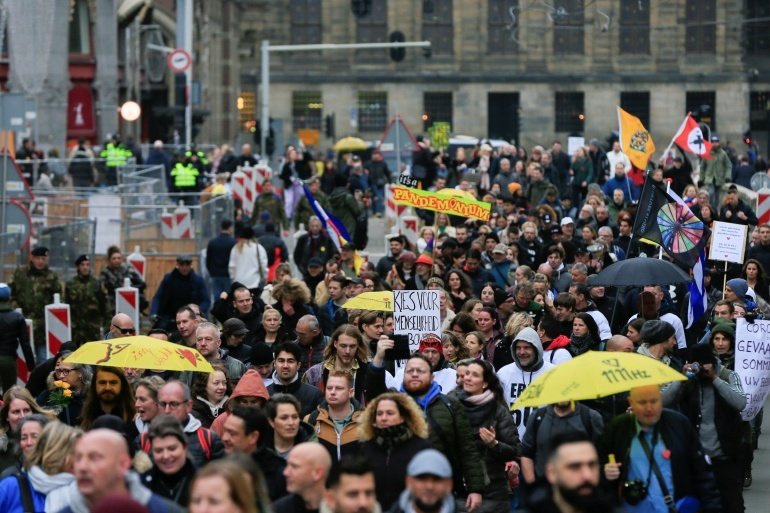 People protest during demonstrations against COVID-19 measures in Amsterdam, Netherlands, November 20, 2021. 