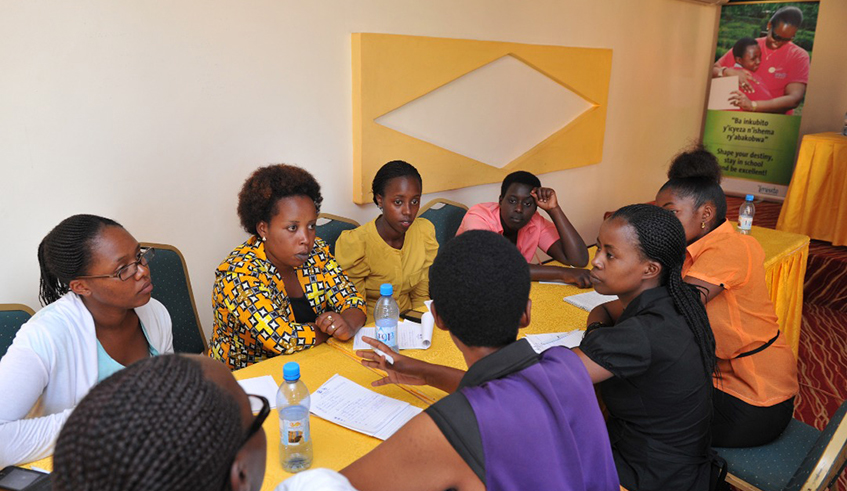 Josiane Ishimwe (in yellow blouse) with other Best Performers under Imbuto Foundation during a leadership workshop at Village Urugwiro. / Photos: Courtesy.