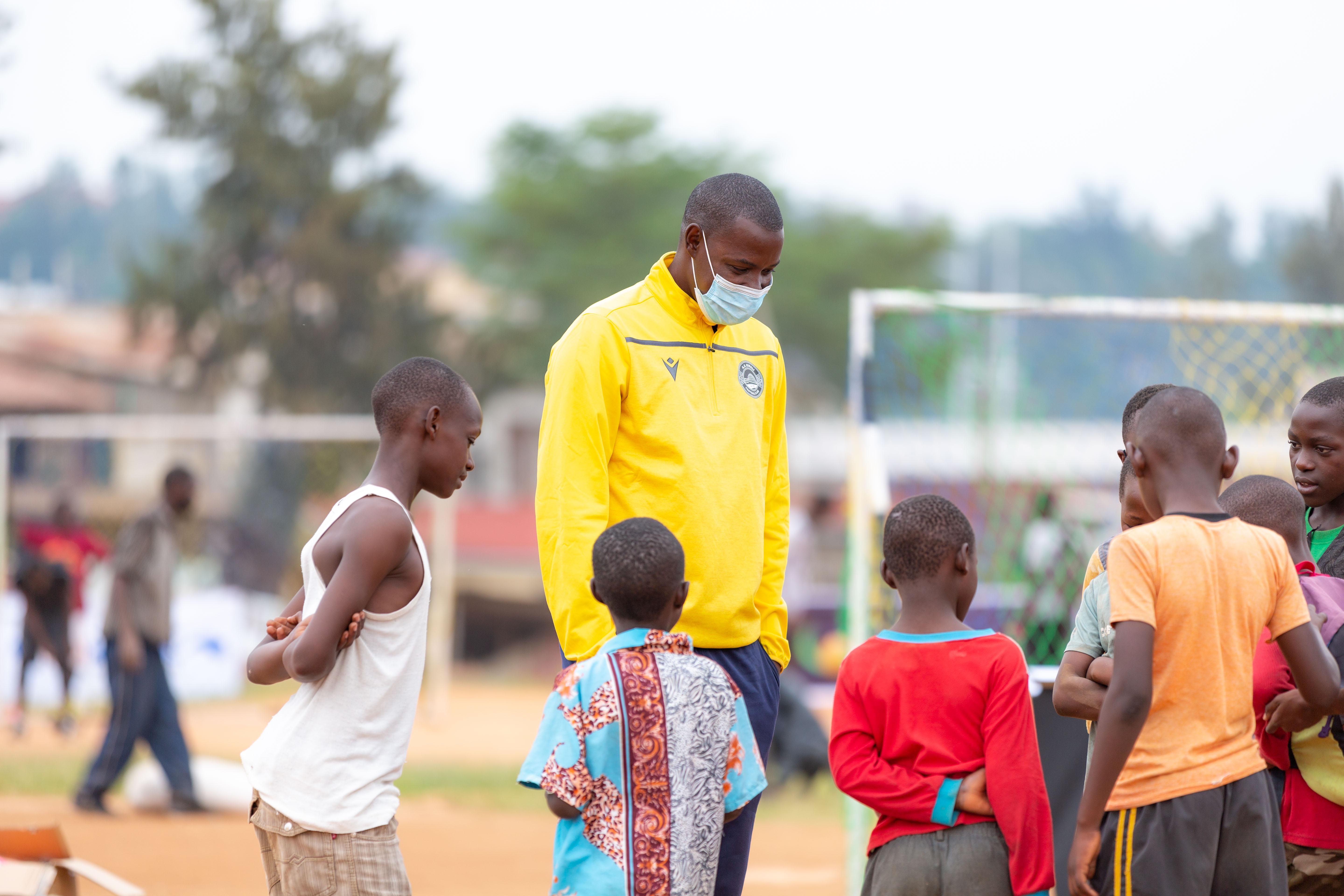 Jimmy Mulisa chats with children during the 6 Aside Street Football tournament in Nyagatovu. 