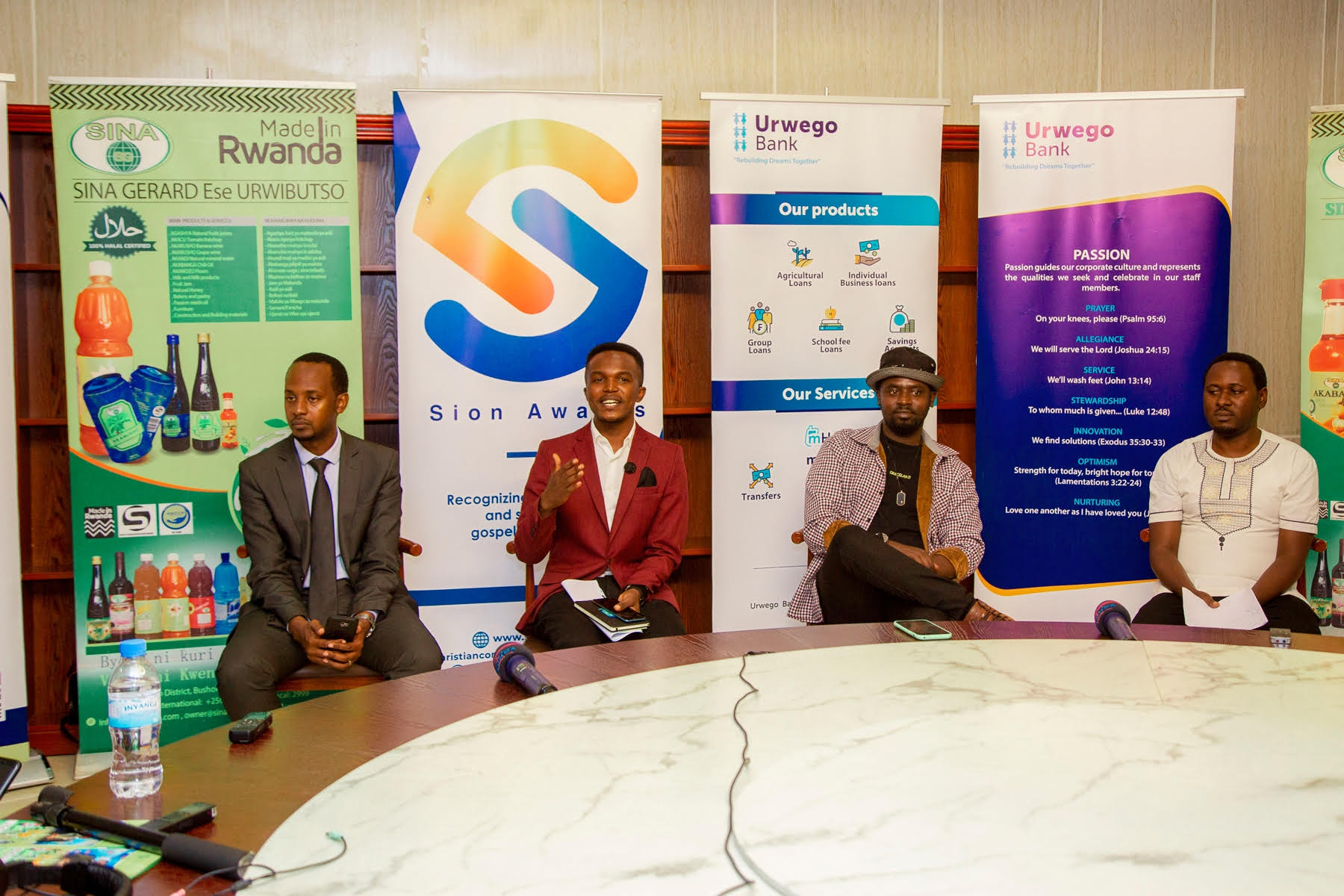 Sion Awards Coordinator, Peace Nicodeme Nzahoyankuye (2nd from Left), addresses the media during the awards launch on Thursday, November 25. 