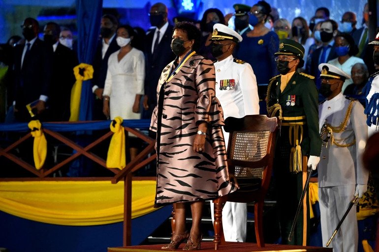 Barbados' first president Sandra Mason, stands after being sworn in at midnight. 