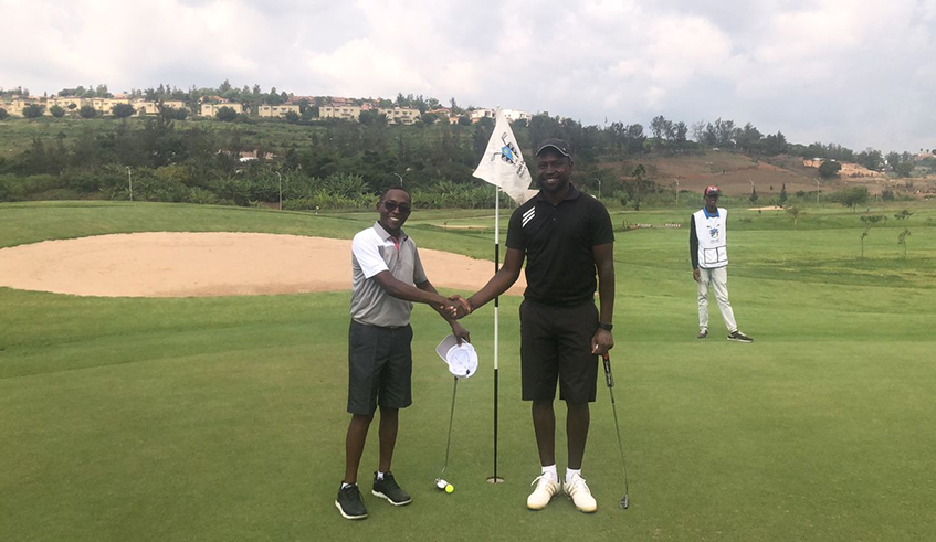 James Muigai (L) shakes hands with Olwit after the final of the PMC league on Thursday at Kigali Golf Course . / Courtesy