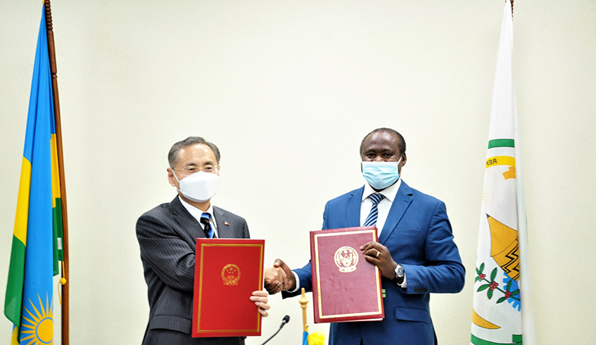 The Minister of Finance and Economic Planning  Uzziel Ndagijimana and Rao Hongwei, the Chinese Ambassador to Rwanda during the signing ceremony in Kigali on December 7. / Courtesy