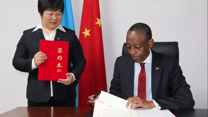 Ambassador James Kimonyo to China and  Ni Yuefeng, the Minister and Secretary of the Chinese Communist Party  sign the MoU on Monday, November 29 . / Courtesy