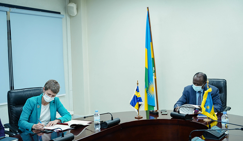 Minister of Finance and Economic Planning, Uzziel Ndagijimana and the Ambassador of Sweden in Rwanda, Johanna Teague sign the MoU in Kigali on December 8. / Photos by Dan Nsengiyumva