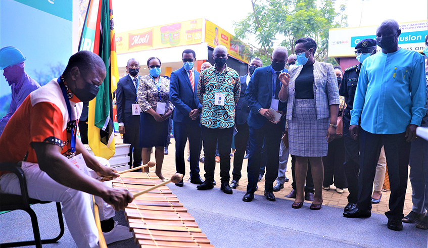 Minister for Trade and Industry Bu00e9ata Habyarimana flanked by other officials visit the Mozambique stand after officially opening the 24th edition of the Rwanda International Trade Fair at Gikondo Expo Grounds on Tuesday, December 14 . The 2021 trade fair edition brought together over 400 exhibitors, both nationals and foreigners from 16 countries. / Photos: Craish Bahizi.