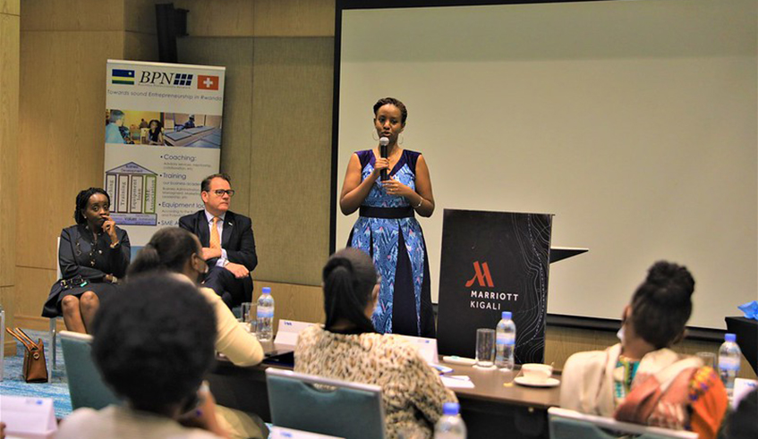Rica Rwigamba, the country representative of MasterCard Foundation, speaks during the launch of the four-day workshop for 60 women entrepreneurs as Robin Bairstow, I&M Bank Rwanda Chief Executive, and Alice Nkurikiyinka, BPN Country Director look on in Kigali on Monday, December 13. / Photo: Craish Bahizi.