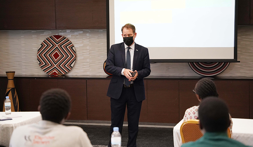 Chief Executive of I&M Bank Rwanda, Robin Bairstow addresses the participants in the working in Kigali on Thursday, December 16, 2021. / Photos by Craish Bahizi