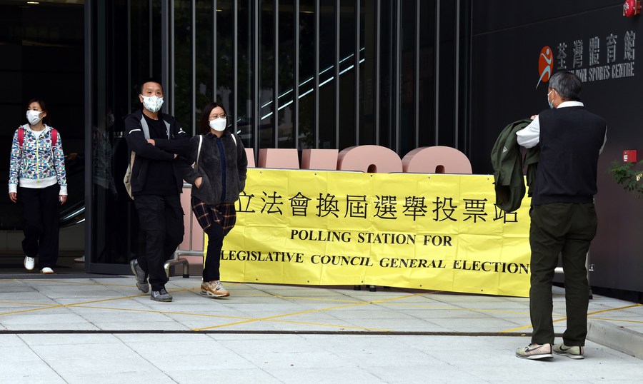 Voters leave a polling station after casting ballot in Tsuen Wan of Hong Kong, south China, Dec. 19, 2021. / Xinhua/Lo Ping Fai