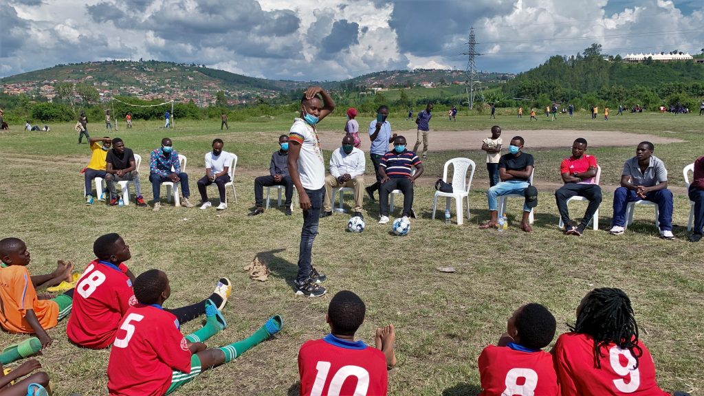 Yves Mitsindo talks to youngsters of the Future Hope Rwanda Football Academy. The Belgian midfielder promised to help the youth with equipment like boots and balls. / Courtesy.