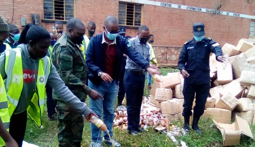 Rwanda National Police officers and district officials in operation to seize assorted illicit and substandard drinks in Kirehe District on Monday, January 3.2022 . / Courtesy