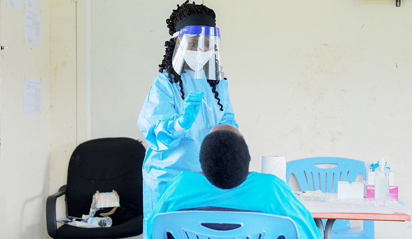 A medic conducts Covid 19 testing exercise in Kigali last year. / Craish Bahizi