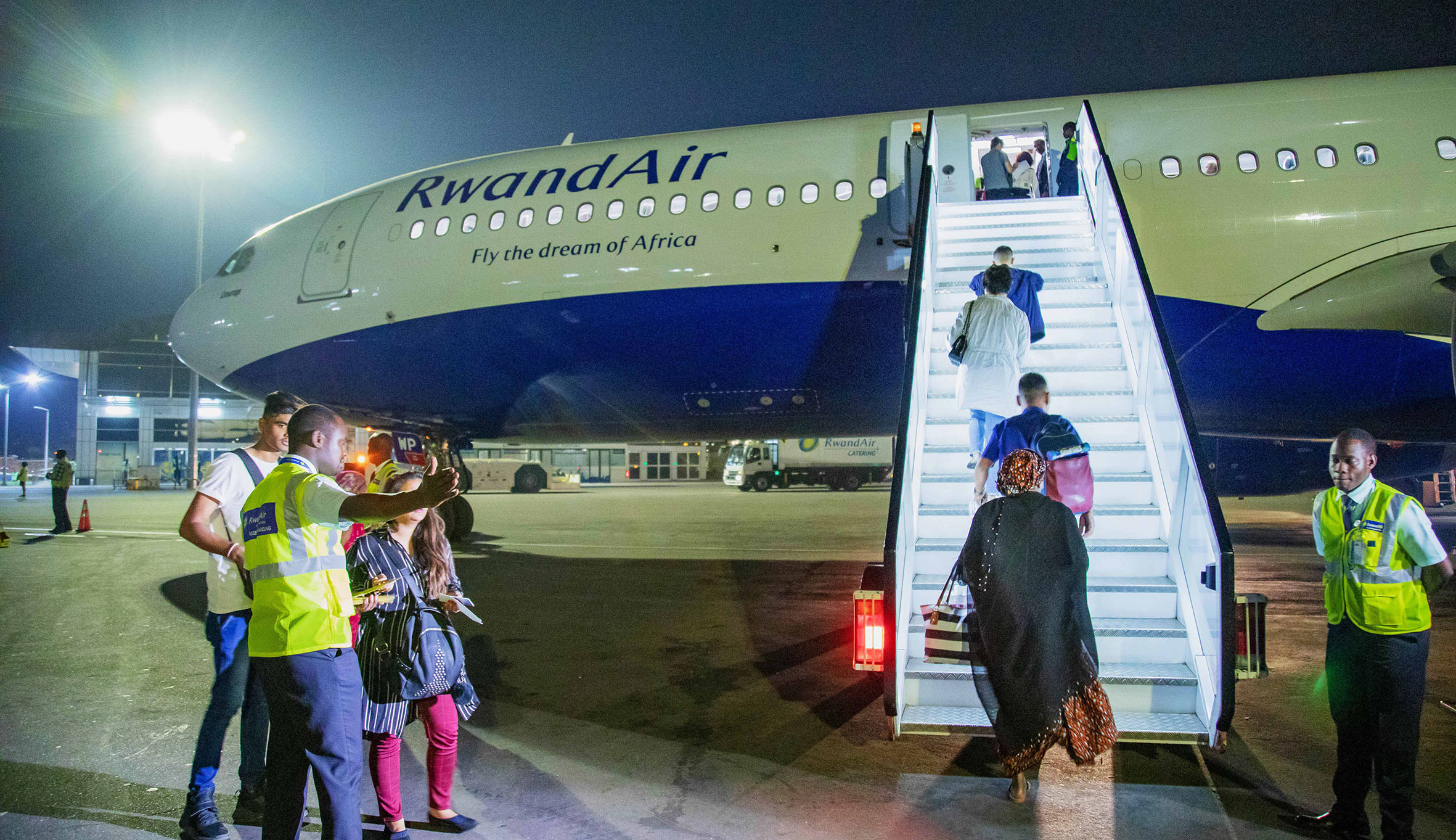 Travellers board a RwandAir plane at Kigali International Airport in 2020. 