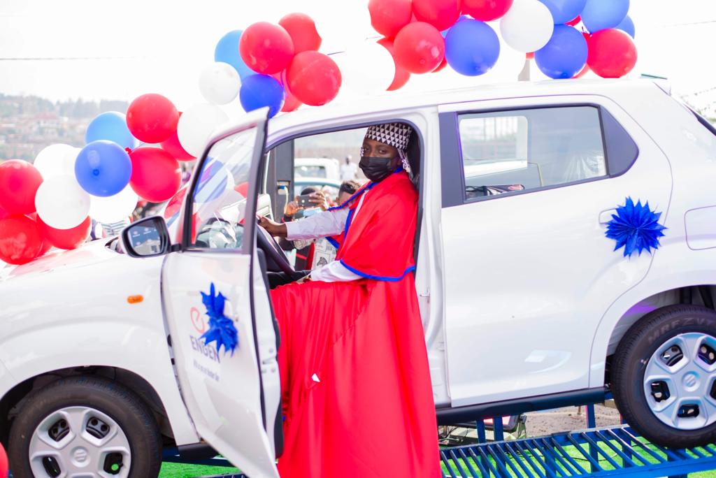 Habineza poses for a photo in a brand new car. 