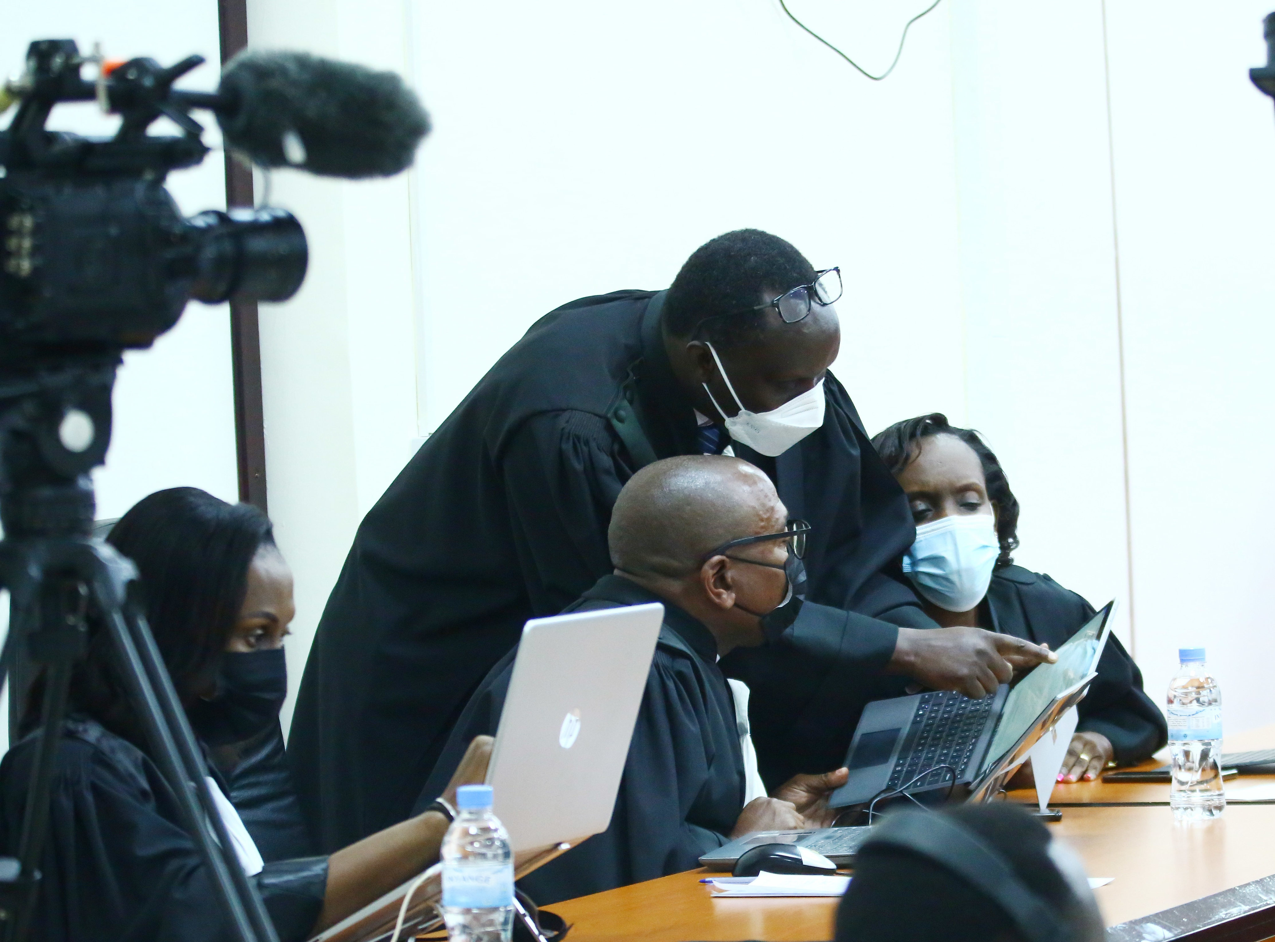 Prossecutors consult one another during the appeal hearing of the FLN terror case in Kigali on January 17, 2022. 
