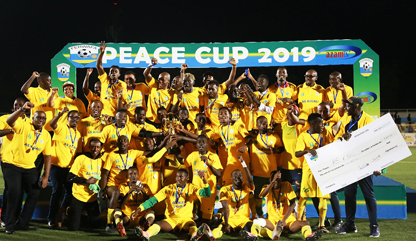 AS Kigali players and staff celebrate the 2019 Peace Cup Trophy.Peace cup set to return after two years . / File