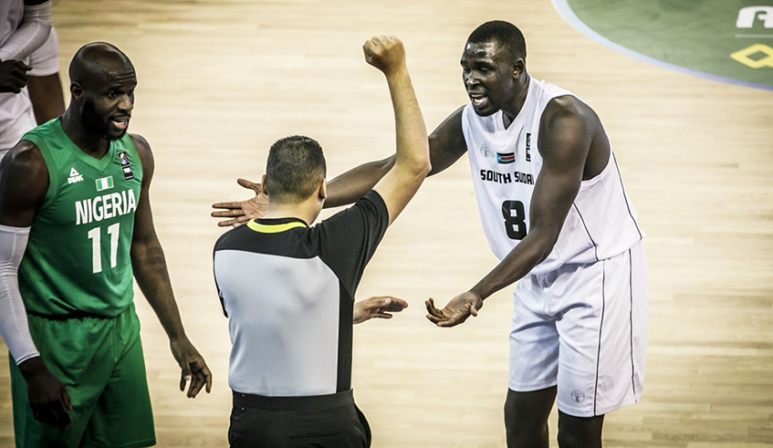 South Sudanese basketball star Kuany Ngor Nguany (right) has praised the progress of the Rwanda national basketball team. / Courtesy