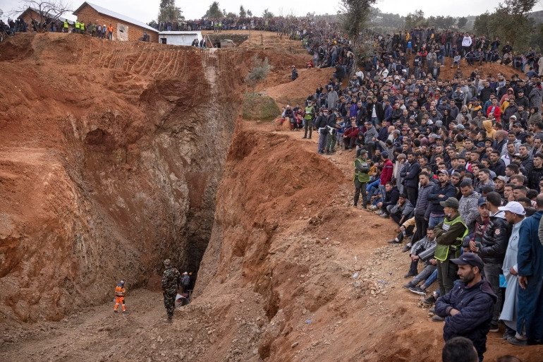 Bystanders watch as Moroccan emergency teams attempted to rescue five-year-old Rayan Awram. 