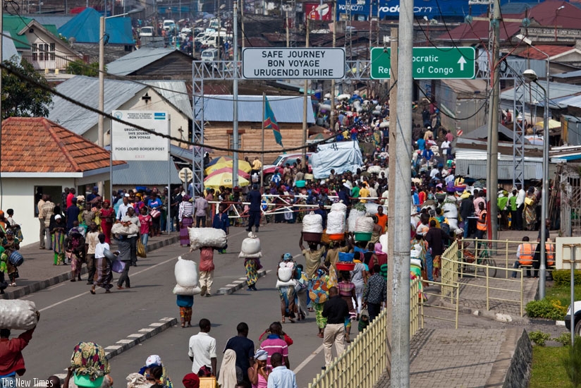 Business persons from Rwanda and DRC crossing la Petite Barriere, the border between Goma in DRC and Rubavu in Rwanda. 