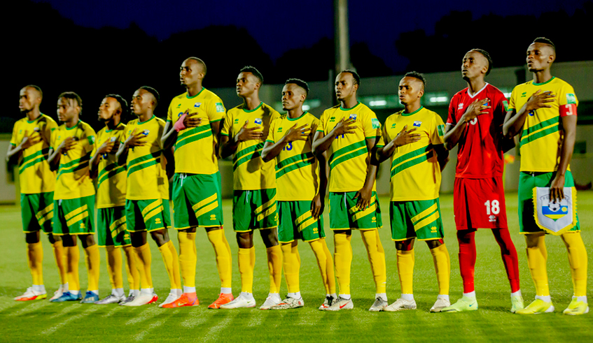 Amavubi players sing the national anthem before the an Africa nations cup qualifier against Mali at Kigali stadium last year. / Courtesy