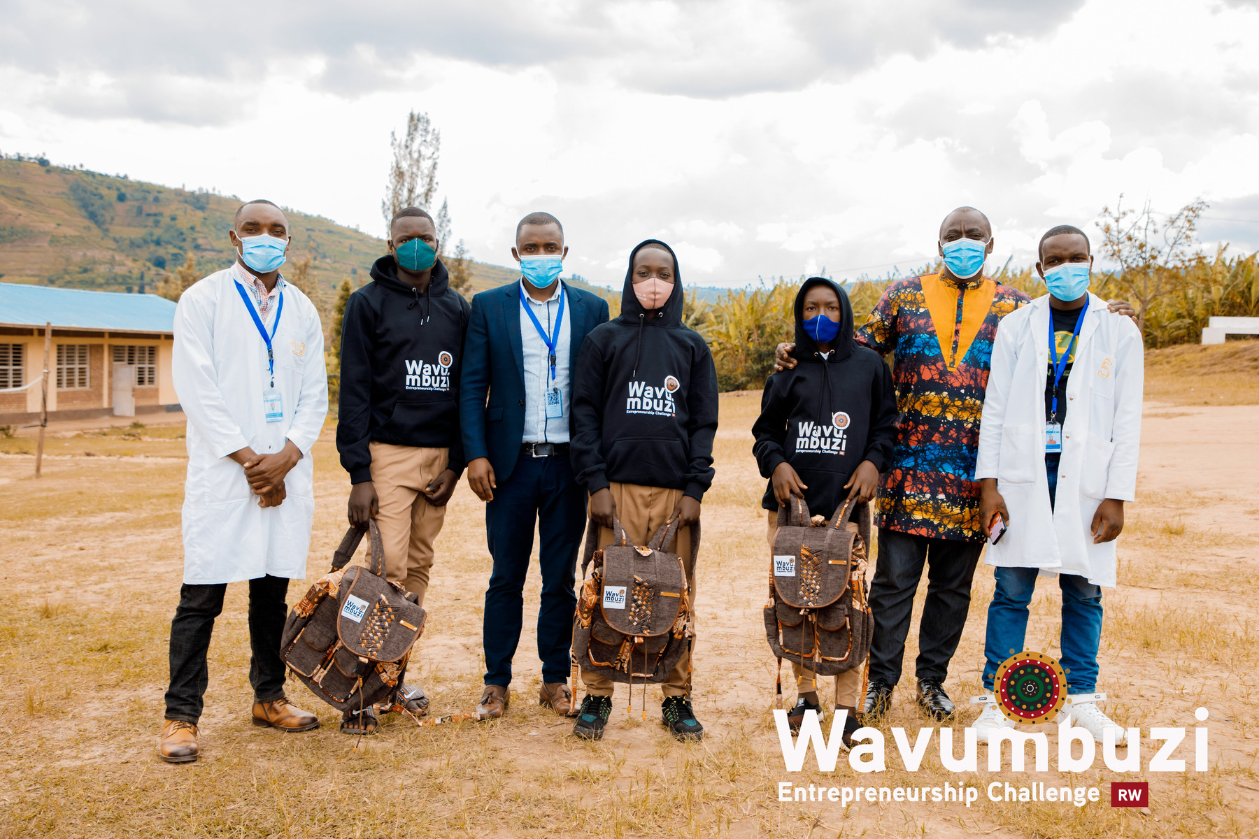 Students at GS Nyabisiga in Rulindo District pose with their teachers, head teacher and a Wavumbuzi Staff as they're awarded as weekly top performers during the Wavumbuzi Entrepreneurship Challenge.