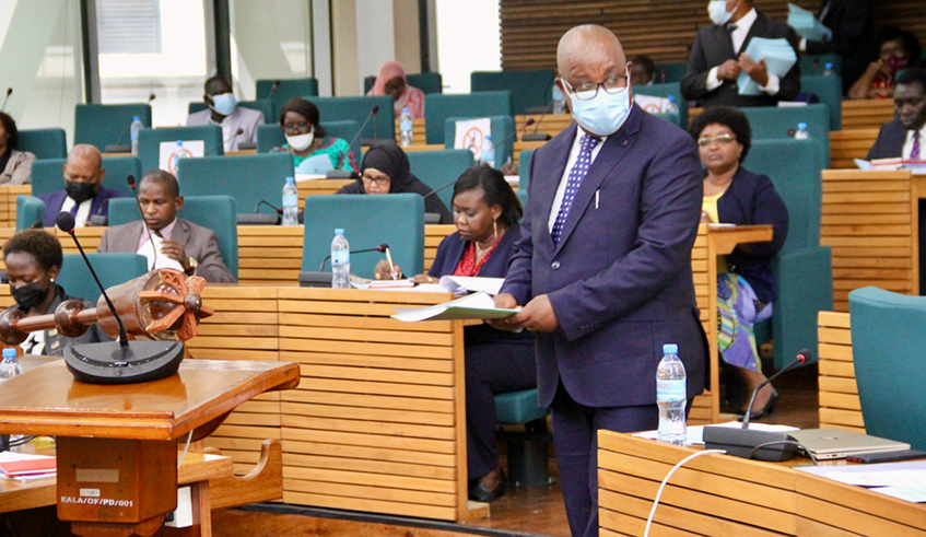 The acting Chairperson of the EAC Council of Ministers, Amb Ezechiel Nibigira of Burundi, lays the Financial Statement for the Supplementary Budget for the financial year 2021-2022 on the table of the House on Feb 16. / Courtesy