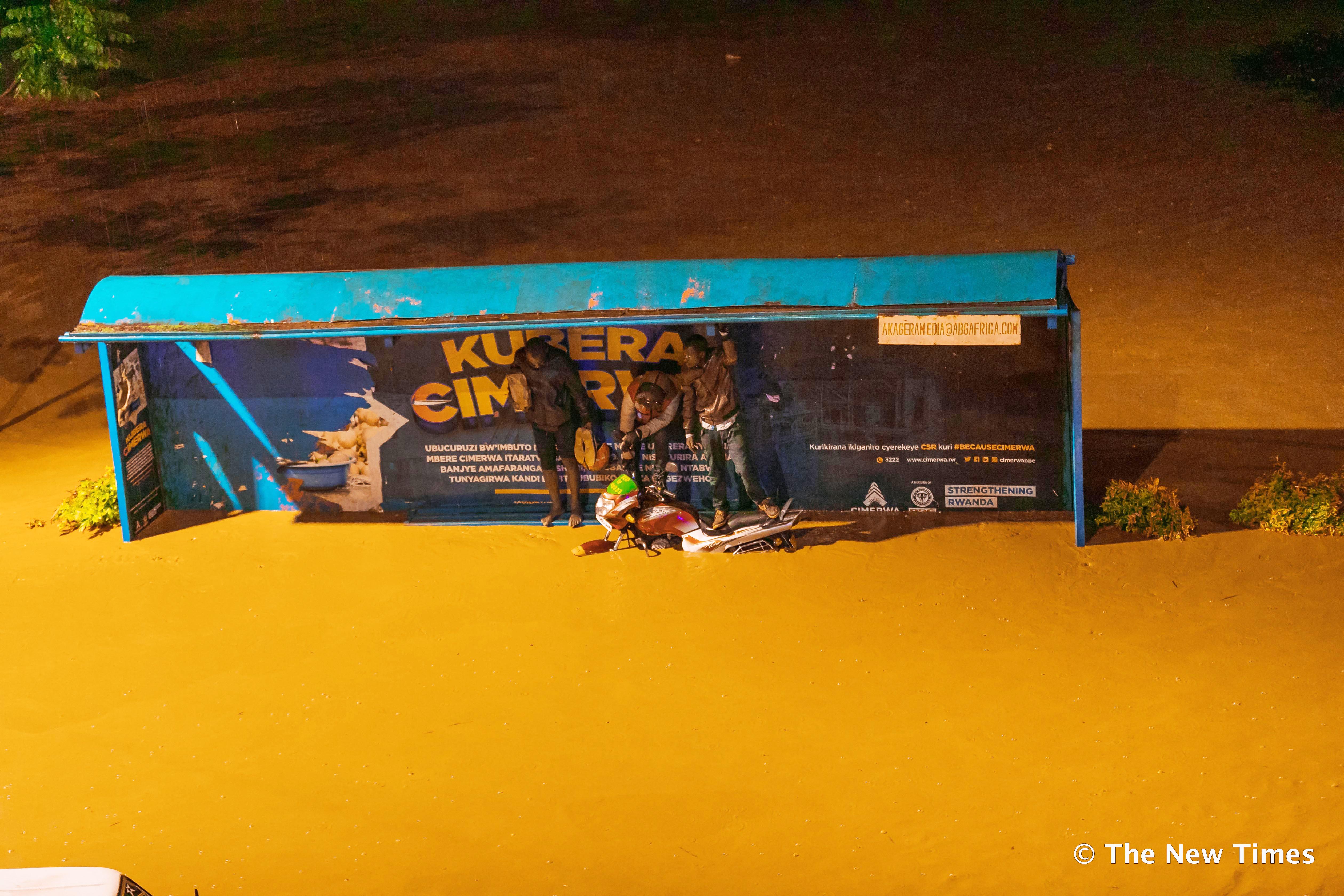 Residents stranded in a flooded road in Kigali on February 2, 2020.File