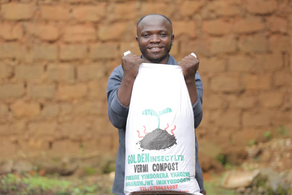 Dominique-Savio Imbabazi, an insect breeder and founder of Golden Insect, showcases a package of his product. 