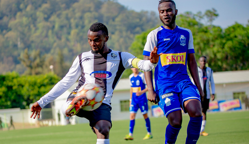 APR FC midfielder Djabel Manishimwe tries to get past a Rayon Sport player in the first leg at Kigali stadium which the army side won 2-1. / Photo: Courtesy.