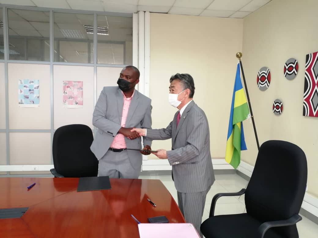 H.E Masahiro IMAI, Ambassador of Japan to Rwanda after signing the grant contract with Isaac Hangimana Mugabe, Legal Representative of Hand in Hand for Development (HIHD)