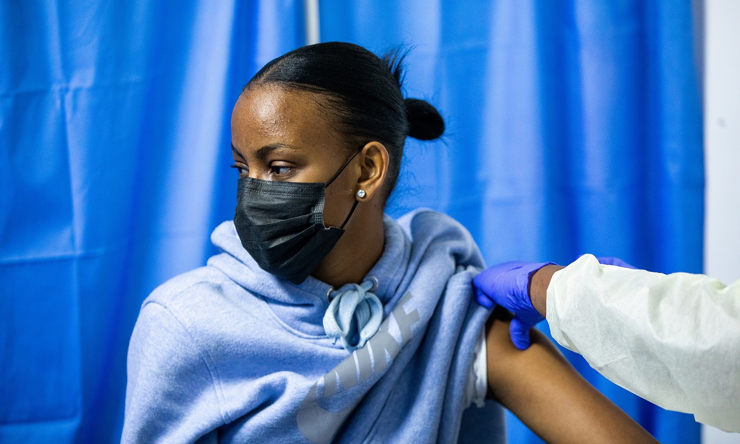 One of the contestants receives a booster jab on Wednesday. 