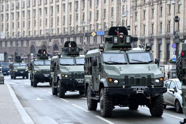 Ukrainian military vehicles patrol in Kyiv. 