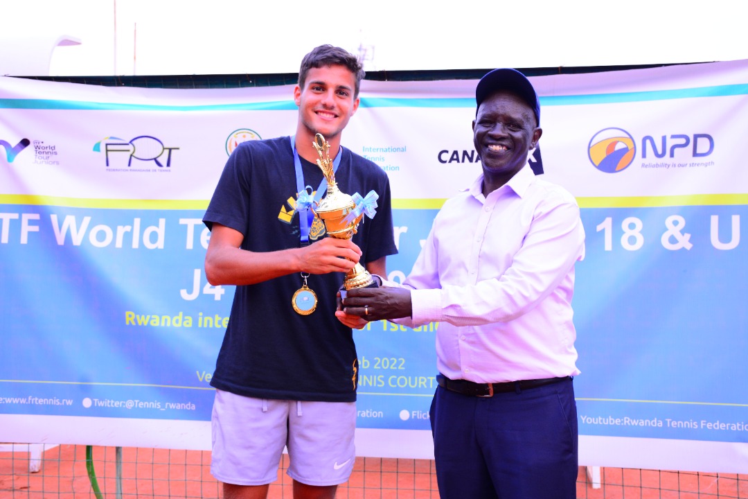 Egyptu2019s Hady el Kordy (left) receives the boysu2019 singles trophy from Theoneste Karenzi, the president of Rwanda Tennis Federation. / Courtesy