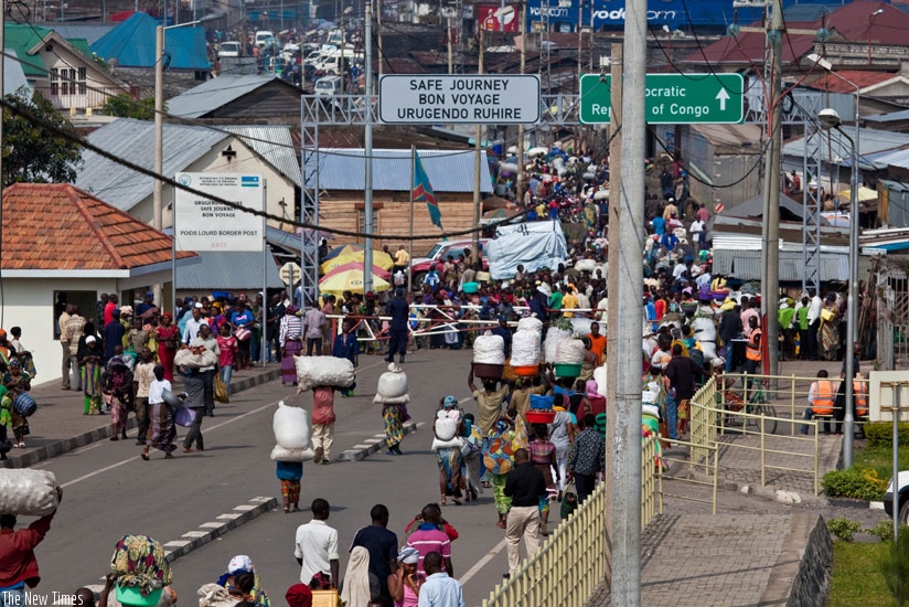 Business persons from Rwanda and DRC crossing la Petite Barriere , the border between Goma in DRC and Rubavu in Rwanda.Experts push for review of rules of origin to boost intra-African trade. File