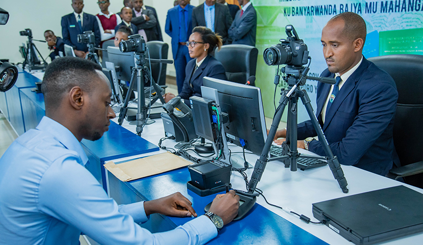 A resident undergoes a required process to get e-passport at the Directorate General of Immigration and Emigration in Kigali on June 28, 2019. Photo: File.