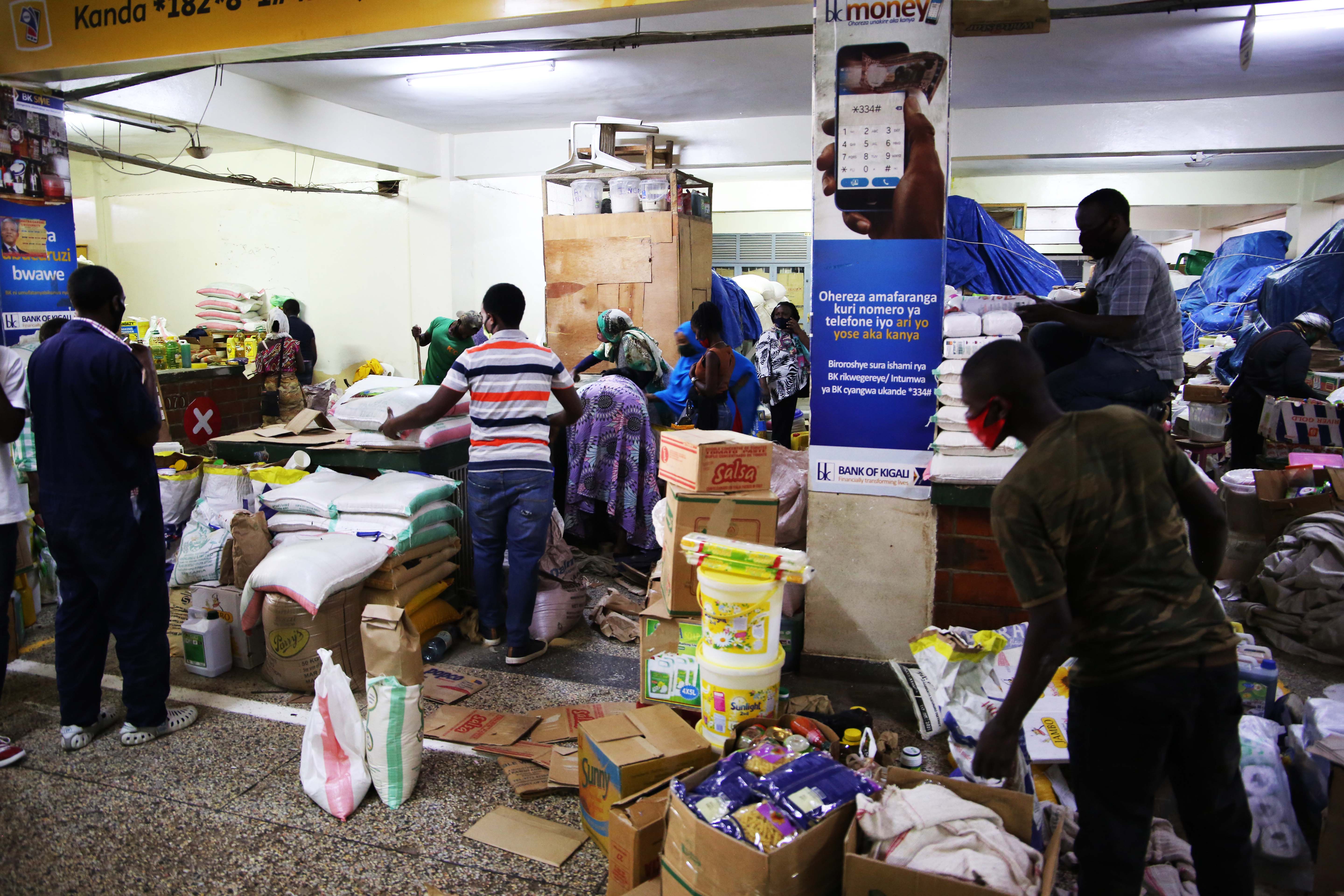 Vendors and buyers of different commodities at Nyarugenge Market in Kigali. 