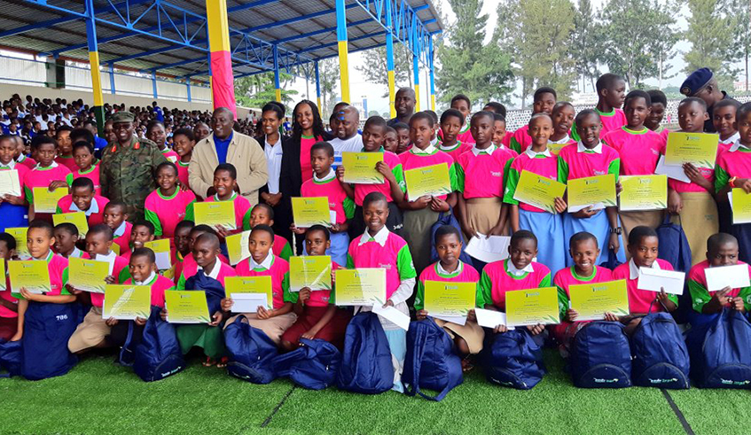 Imbuto Foundation and goverment officials in a group photo with young girls who performed well in schools during the awarding ceremony in Musanze on March 17, 2019./ Courtesy