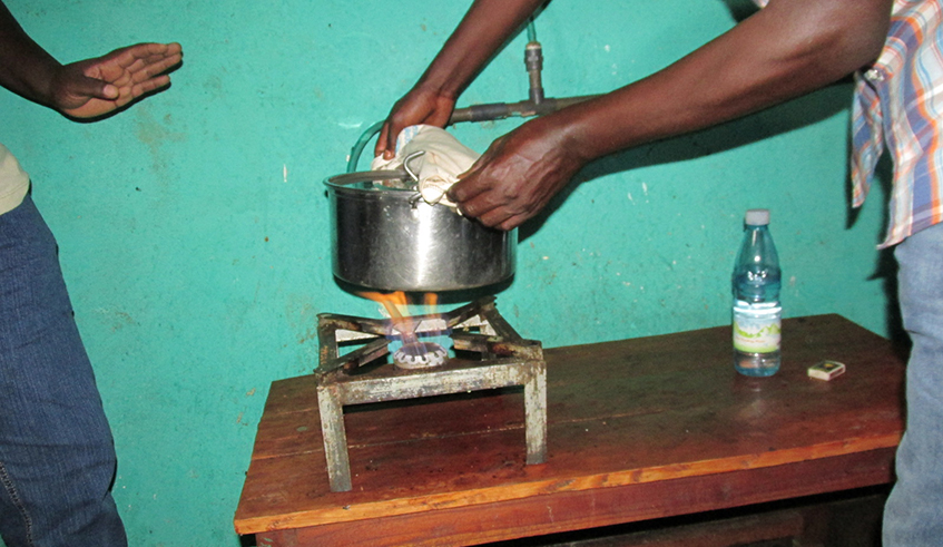 A resident cooks his meal through Biogas in Huye District in January 2022. The Government is committed to invest in resources and ensure that the biogas programme becomes a success and delivers the intended results./ File