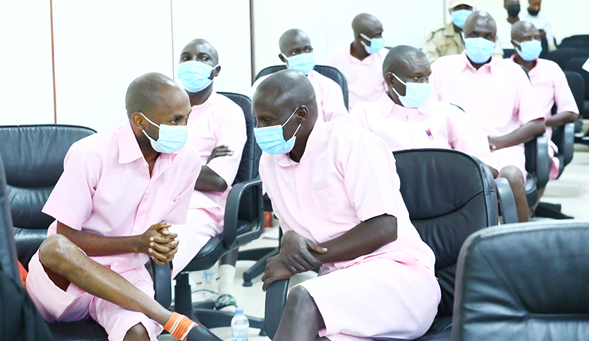 Convicts Callixte Nsabimana and Herman Nsengimana interact during the appeal hearing of the FLN terror case in Kigali on January 17, 2022. 