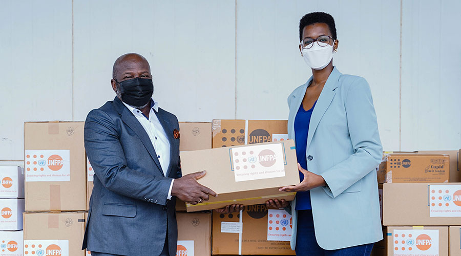The UNFPA Country Representative Kwabena Asante-Ntiamoah hands over the commodities worth more than $1.4 million to Noella Bigirimana Deputy Director General of Rwanda Biomedical Center in Kigali on March 22. 