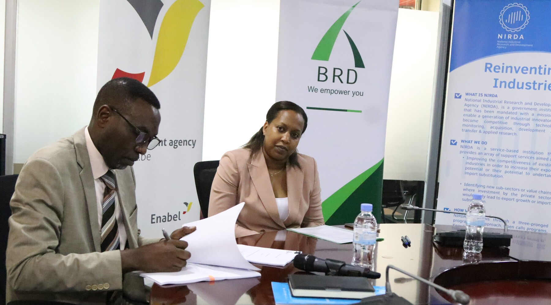 Dr. Christian Sekomo Birame, NIRDA Director General and Kampeta Sayinzoga, BRD CEO during the signing of grant agreement ceremony.