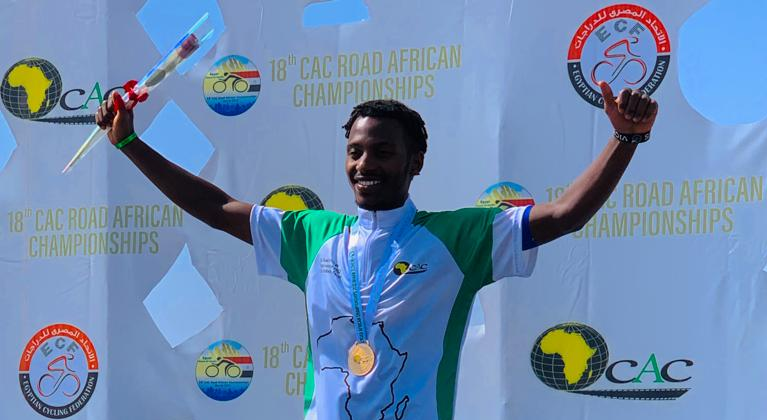 Uhiriwe celebrates on the podium after winning the 2022 Africa Road cycling championship in Egypt on Thursday. Courtesy.
