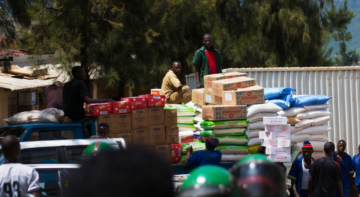 Workers load different commodities to be transported upcountry at Kigali Business District. The country is experiencing a rise in prices of commodities like cooking oil, soap and sugar. 