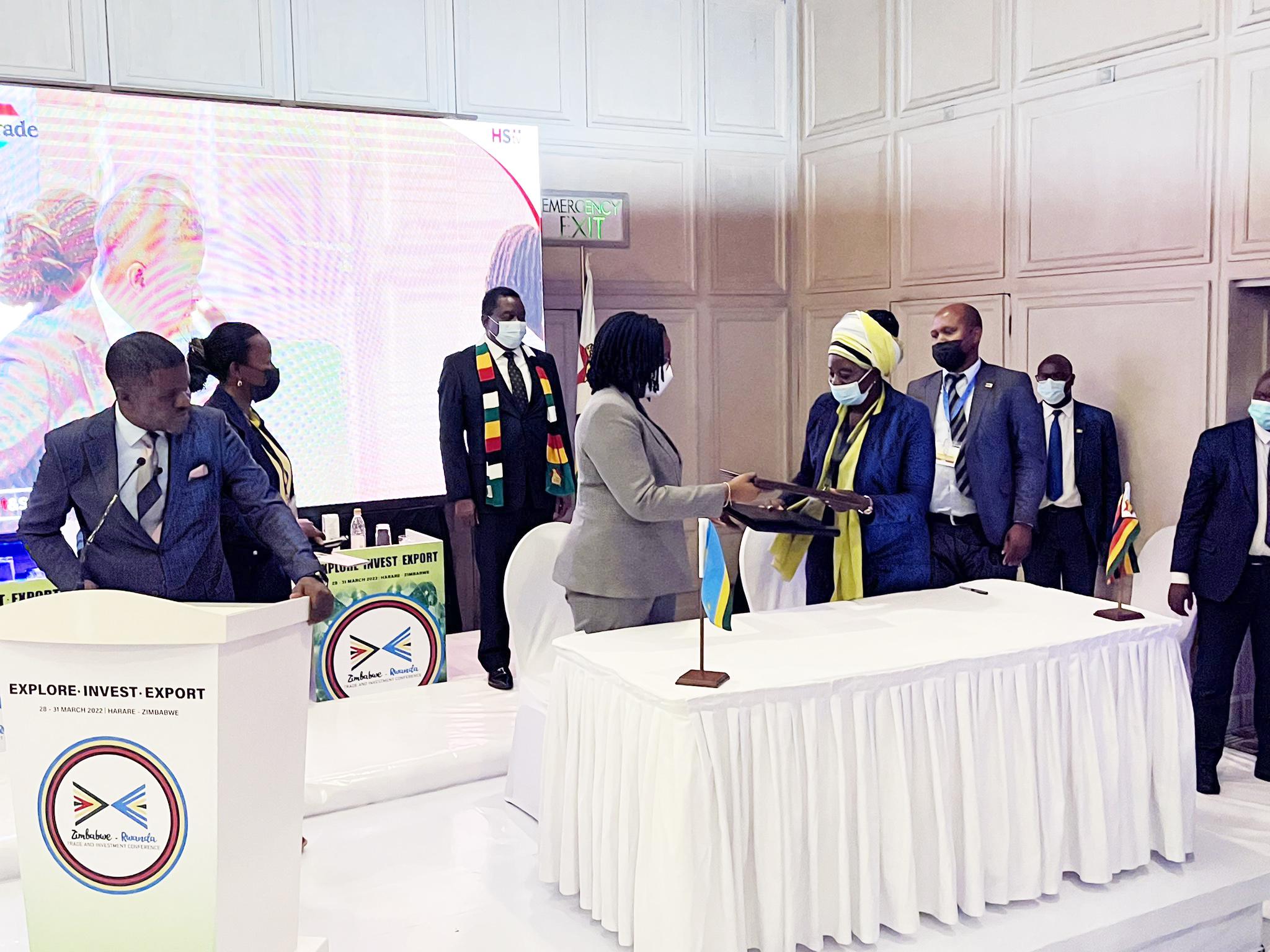 Minister of Trade and Industry Beatha Habyarimana and Zimbabwe's minister exchange documents after signing the agreement .