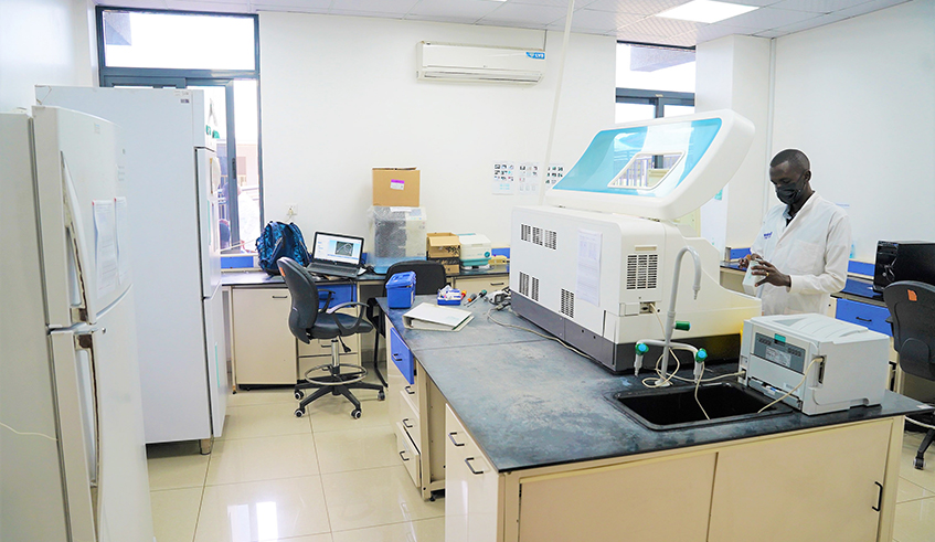 A clinical lab technician conducts a testing exercise at Rwanda Forensic Laboratory .Starting March 1, the lab has rolled out a pilot online portal that aims to speed up the analysis and dissemination of results.  Craish Bahizi