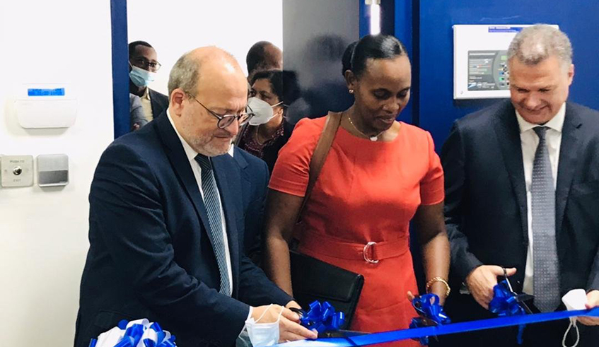 (R-L) Reu0301my Rioux, the CEO of AFD, Claudine Uwera, the State Minister for Finance and Economic Planning, and  Antoine Anfreu0301, the French Ambassador to Rwanda  cut the ribbon to officially open the offices of AFD in Rwanda. / Courtesy