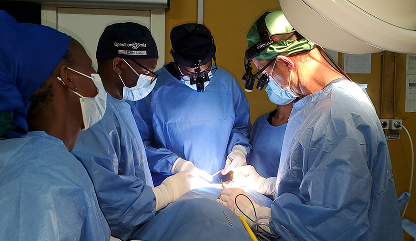 Plastic surgery team from Rwanda and Operation Smile, USA, operating on a child with an orofacial cleft condition at Bushenge hospital last week. Photo/Courtesy