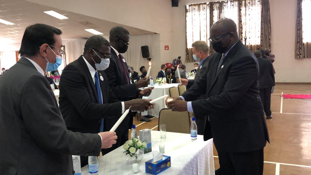 Zimbabweu2019s Deputy of Foreign Affairs and International Trade David Musabayana and Rwanda Ambassador to Zimbabwe James Musoni lit the candle of hope at the commemoration held in Harare.